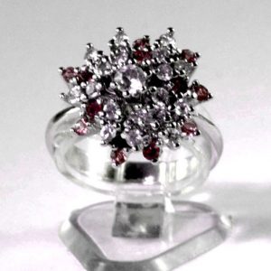 Silver plated ladies dress ring with a combined cluster of small bright crimson and white synthetic stones with a larger white centre stone