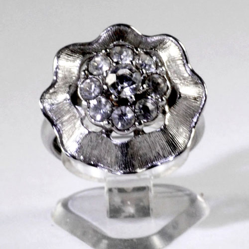 Ladies Silver Plated dress ring with an outer floral style with an inner cluster of clear spinels
