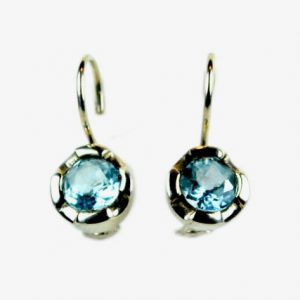 Sterling Silver pierced earrings set with large faceted 8mm diameter round cut natural blue topaz gemstones.