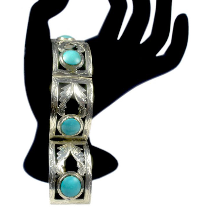 Stering Silver bracelet, hand cut and engraved with four equally spaced round Gilson Turquoise stones